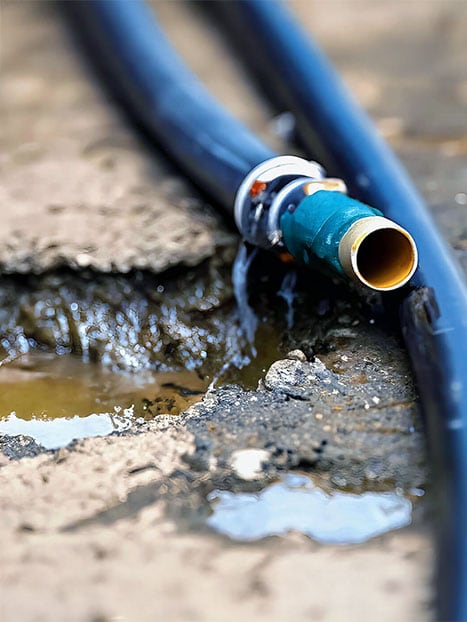 Gold Coast Plumbing Company plumber loading a fully equipped service van